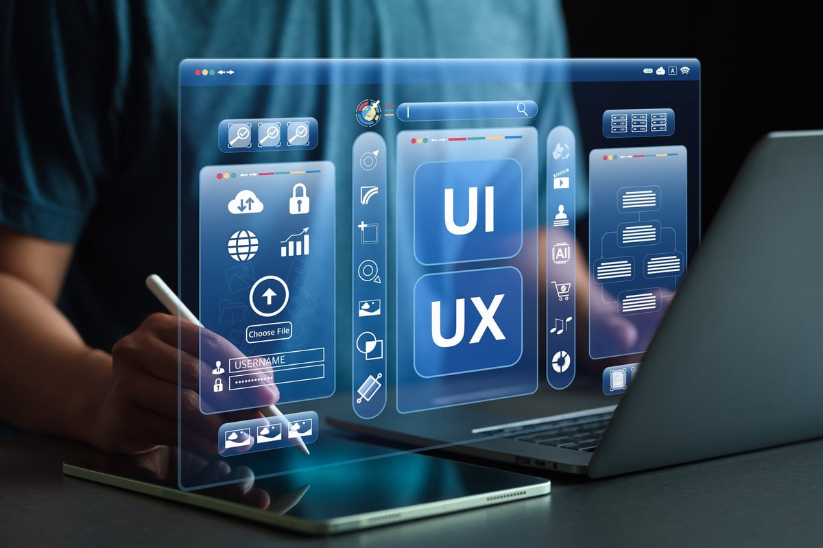 Designer working with virtual UI screens and code interfaces during a website build