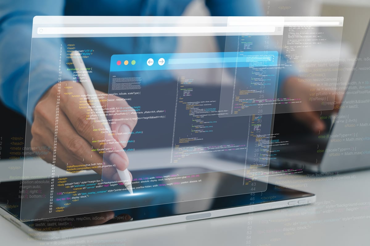 Developer building a website on a tablet with code on screen